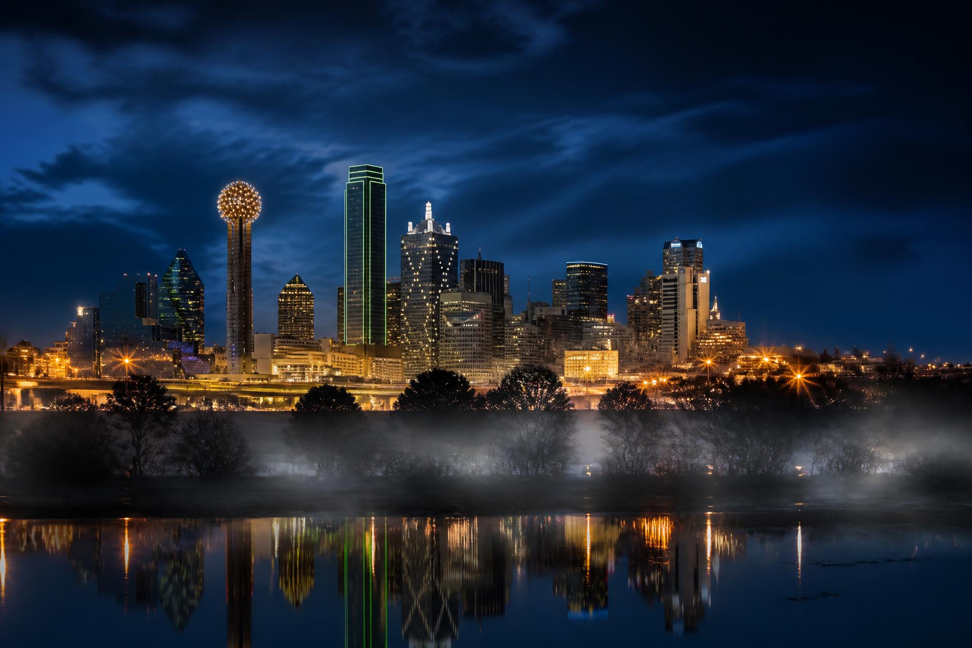 Dallas Fort Worth skyline at blue hour, home base for the MOGDX team.